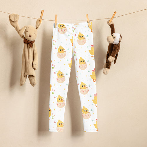 Girls Easter chick buttery soft white leggings with yellow hatching chick pattern accented by flowers and stars