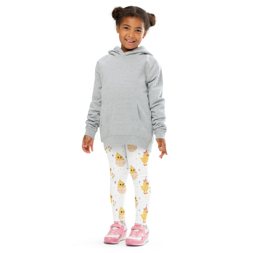Girl wearing gray hooded sweatshirt with long sleeves and front pocket paired with buttery soft easter chick leggings