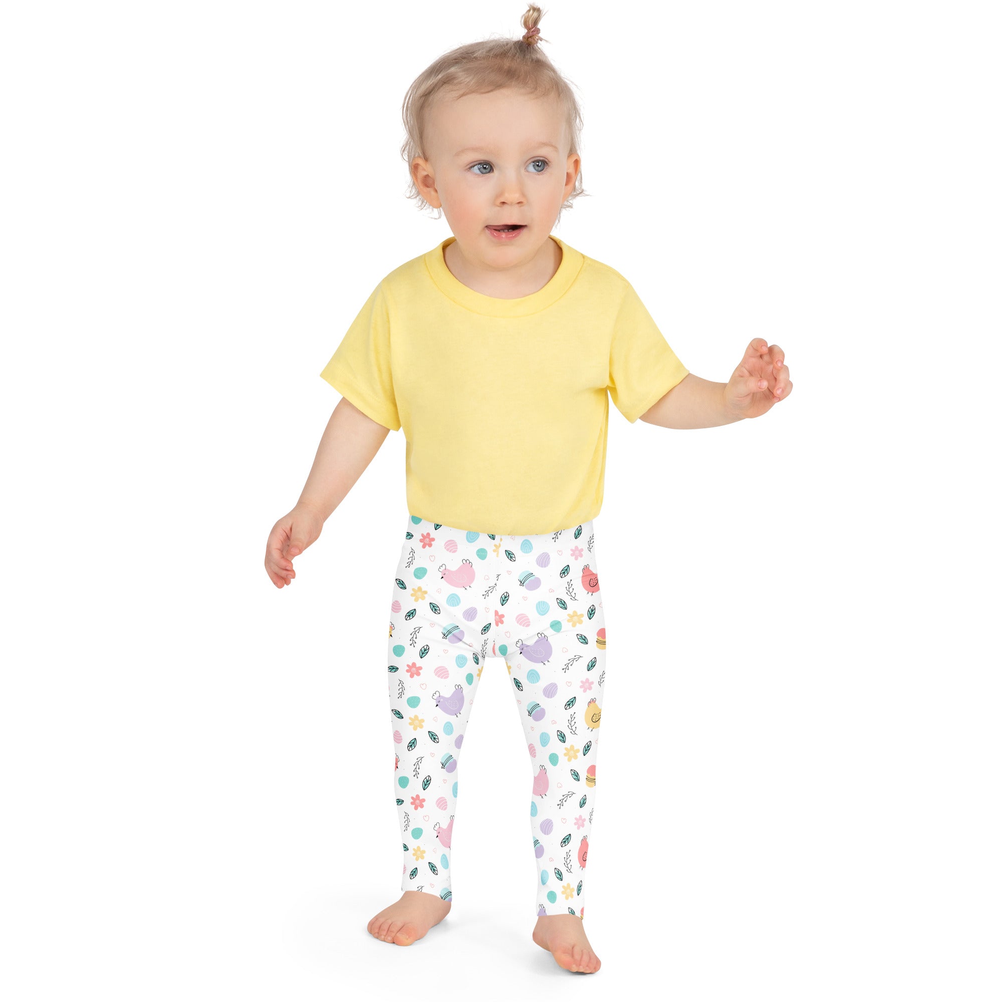 A child wearing girls pastel Easter chick buttery soft white leggings with colorful pastel animal prints and a yellow t-shirt