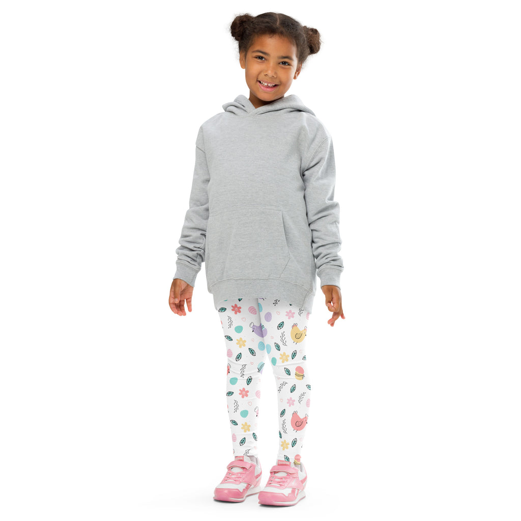 A child wearing pastel easter chick buttery soft leggings with colorful floral and animal prints paired with a gray hoodie