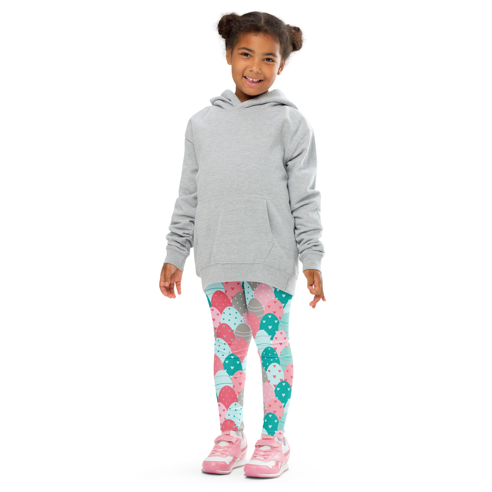 Gray hooded sweatshirt with front pocket and long sleeves worn over girls pink and teal buttery soft Easter eggs leggings