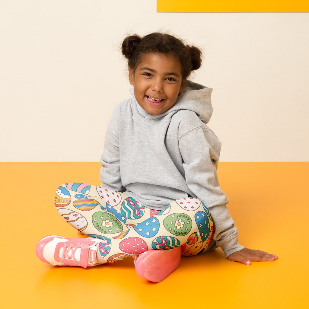 Girls vintage buttery soft leggings with cream base and colorful easter egg patterns for festive wear