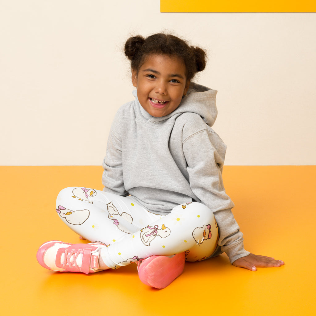 Girls easter duck buttery soft white leggings with playful cartoon ducks pink bows and yellow polka dots pattern