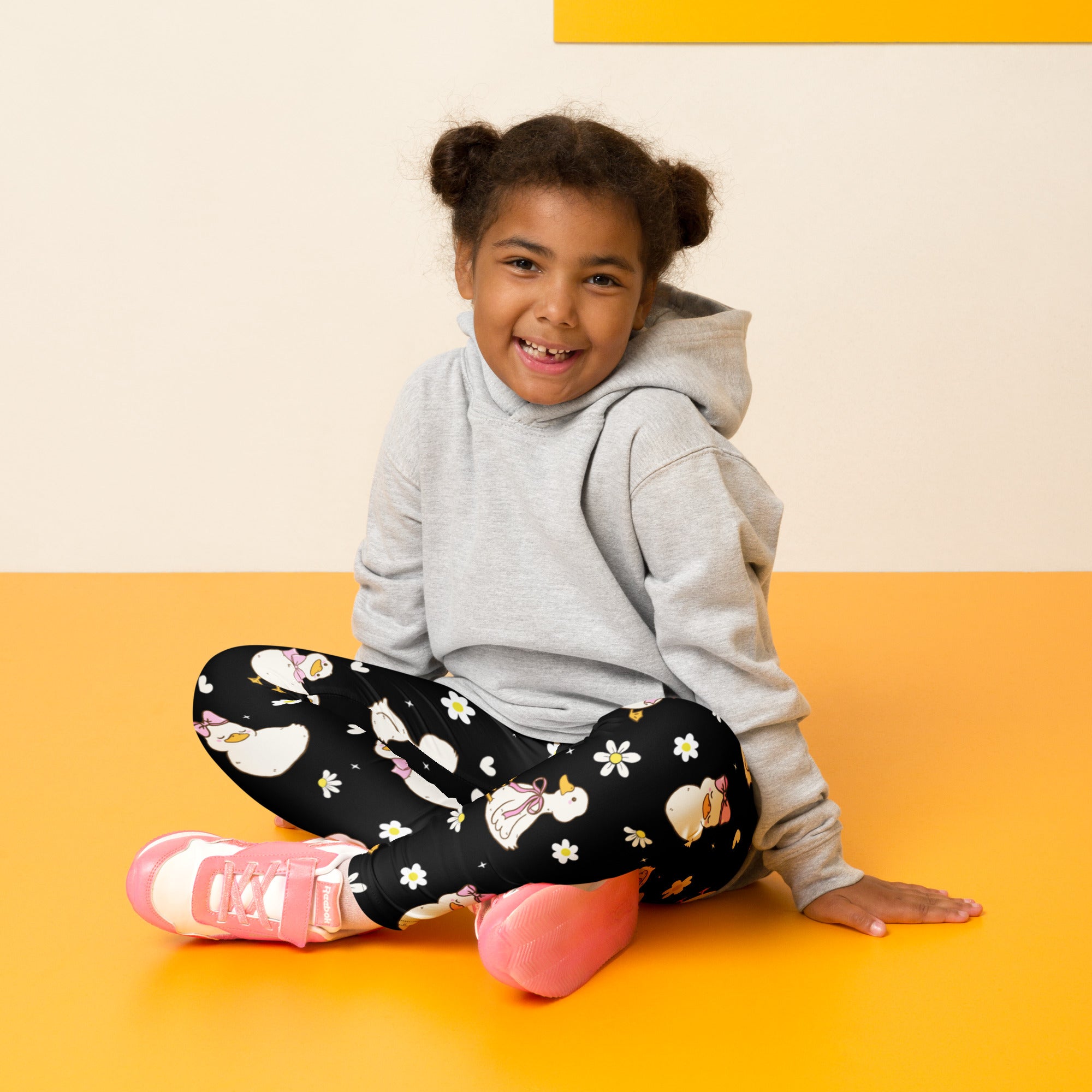 Girls black buttery soft leggings with playful white unicorns daisies and pink bows perfect for Easter