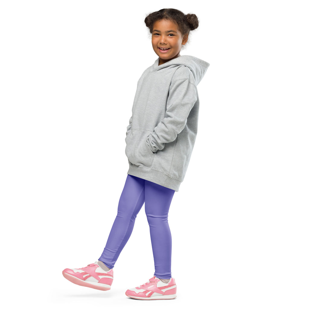 A child wearing buttery soft purple girls leggings and a light gray oversized hoodie with front pockets