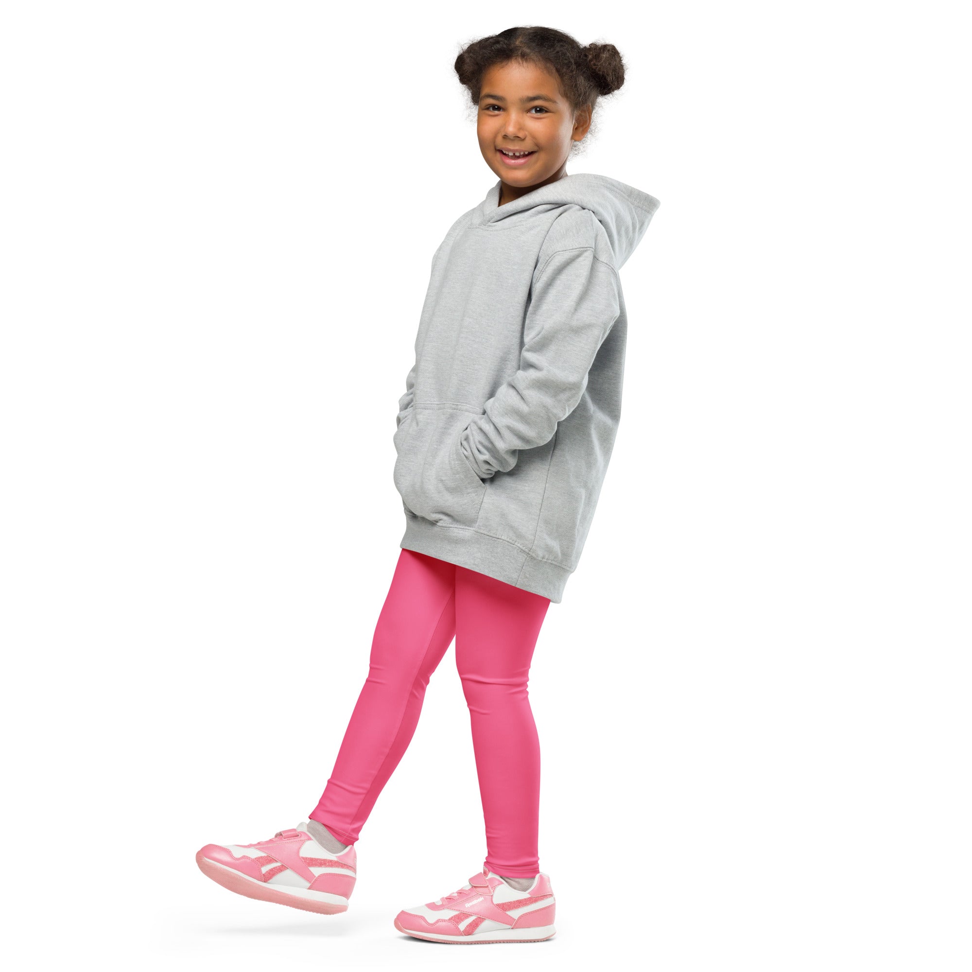 A child wearing buttery soft pink leggings paired with a light gray long sleeve hooded sweatshirt