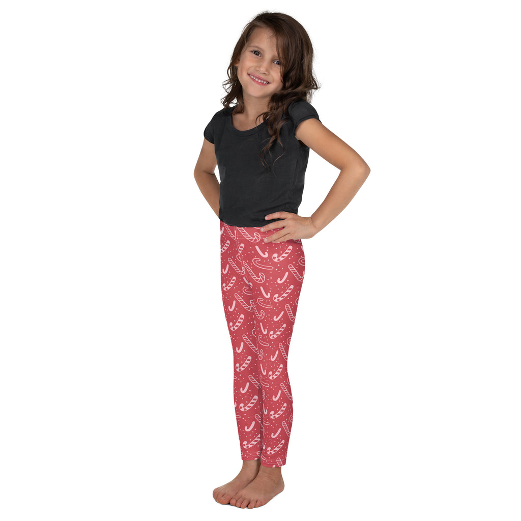 Girls red candy cane leggings with white pattern made from buttery soft fabric for comfortable wear