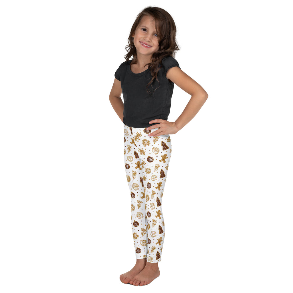 White kids leggings with a festive brown gingerbread cookie and tree pattern made from buttery soft fabric