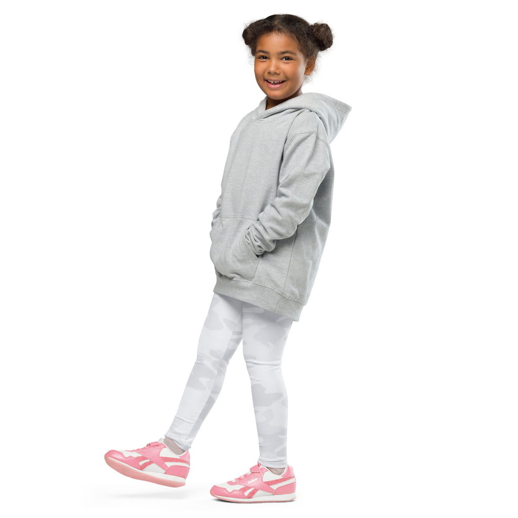 A child wearing kids white camouflage buttery soft leggings paired with a gray hooded sweatshirt and pink sneakers