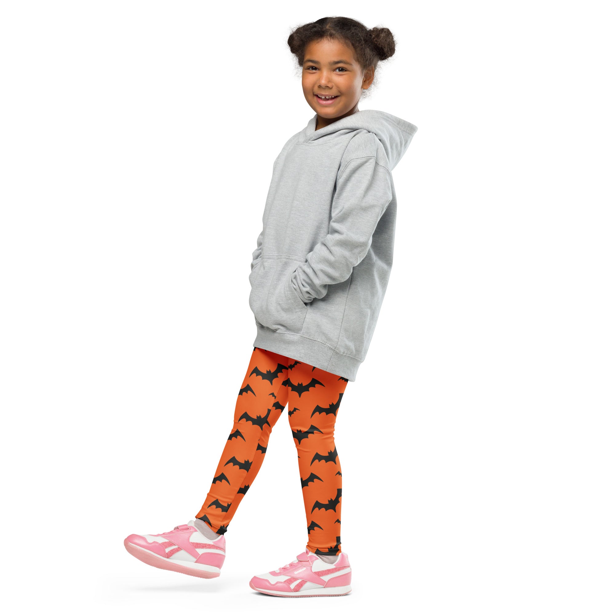 Gray hooded sweatshirt with front pockets and relaxed fit paired with kids orange bats halloween buttery soft leggings