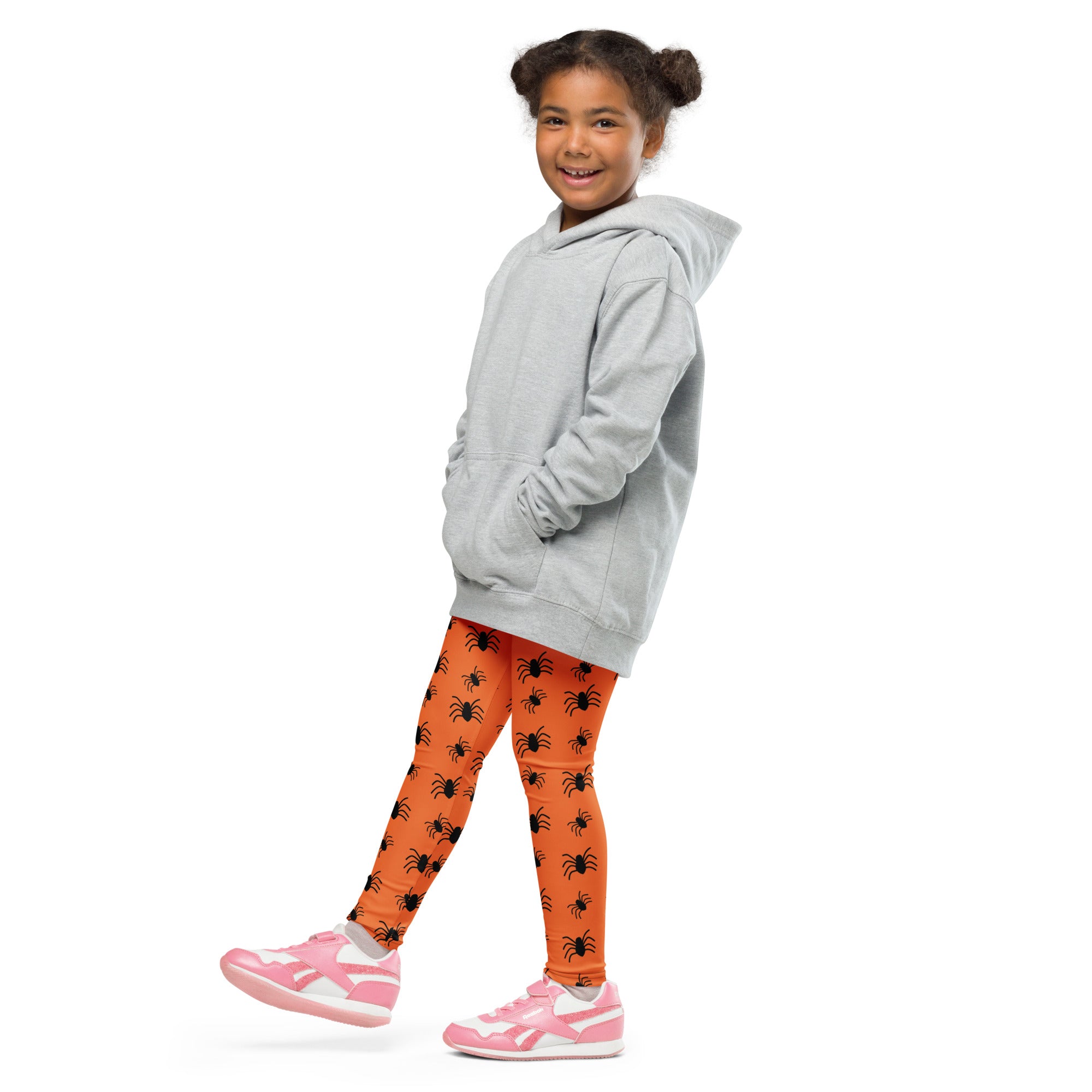 Gray hooded sweatshirt with relaxed fit and front pockets paired with kids orange spider halloween buttery soft leggings