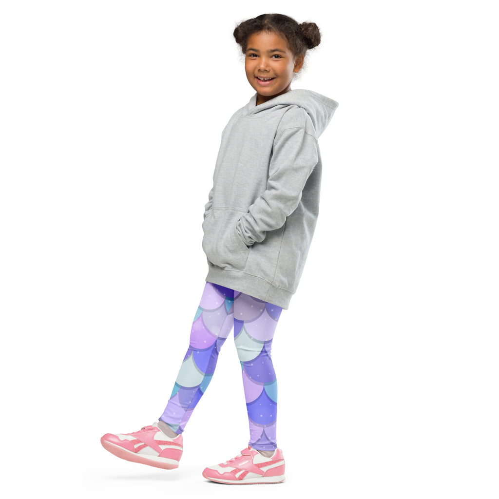 A child wearing girls purple mermaid buttery soft leggings with light gray hooded sweatshirt front view