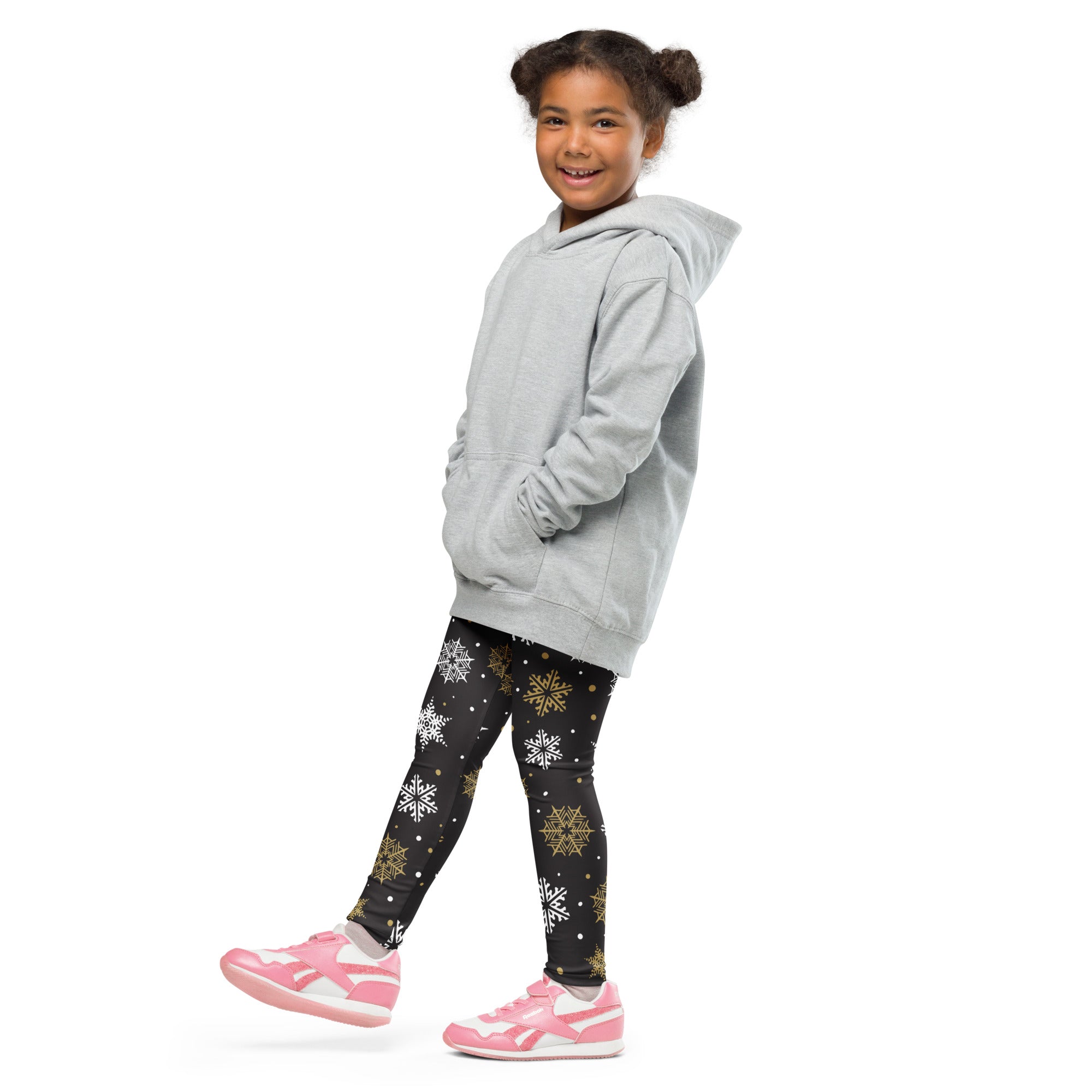 Gray hooded sweatshirt with relaxed fit and front pockets paired with kids gold and white snowflake buttery soft leggings