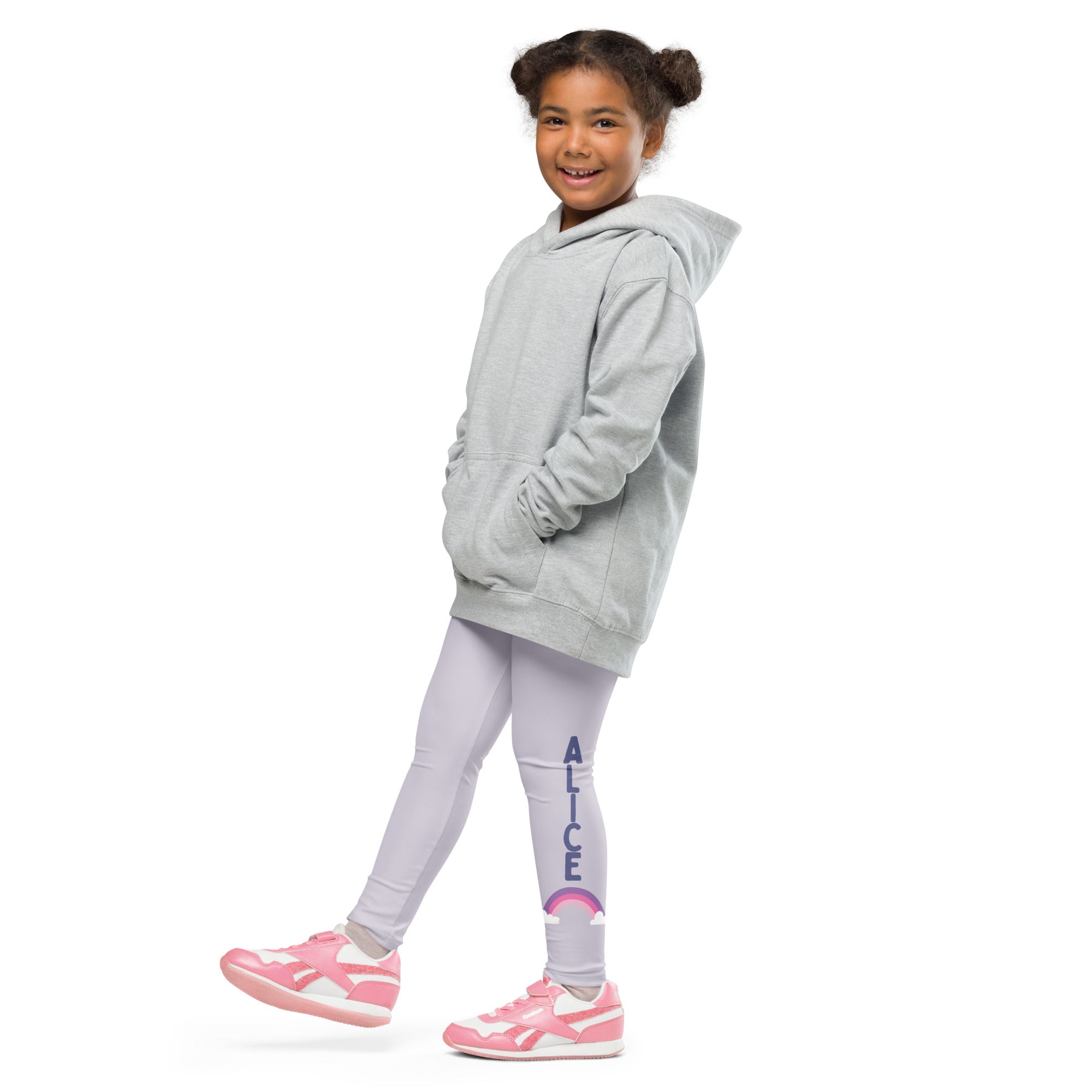 A child wearing light gray girls custom name buttery soft leggings with rainbow and matching hooded sweatshirt
