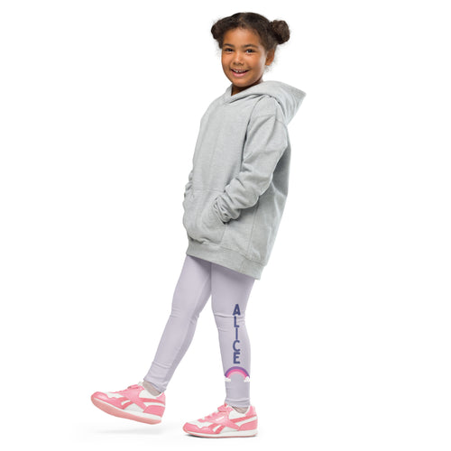 A child wearing light gray girls custom name buttery soft leggings with rainbow and matching hooded sweatshirt