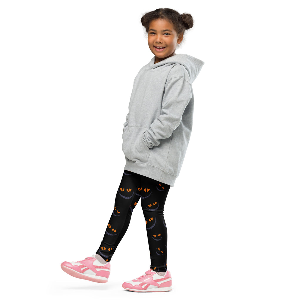 Gray hooded sweatshirt with front pockets and relaxed fit paired with kids Halloween grinning cat buttery soft leggings