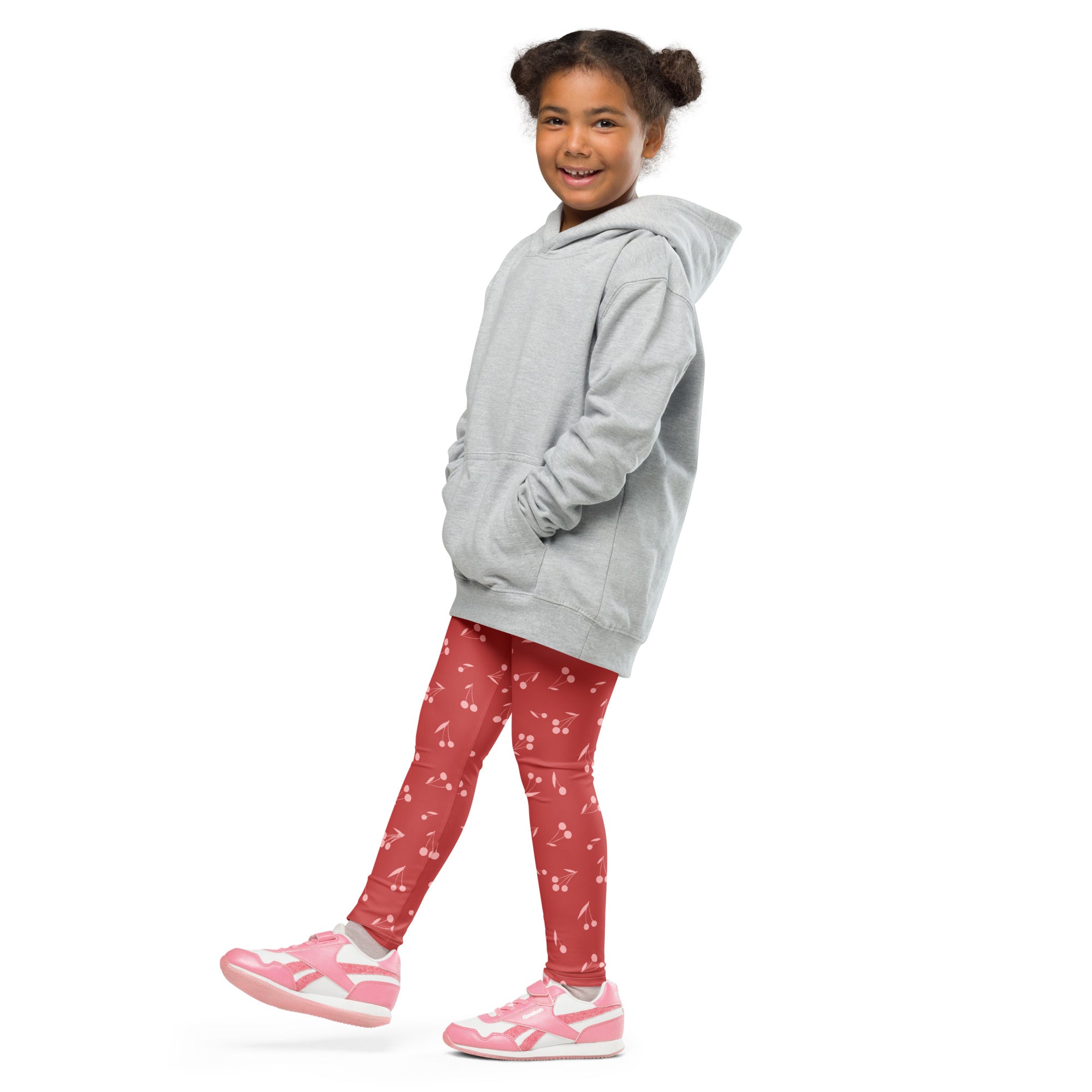 Gray hooded sweatshirt with front pockets and relaxed fit paired with girls pink cherry pattern buttery soft leggings