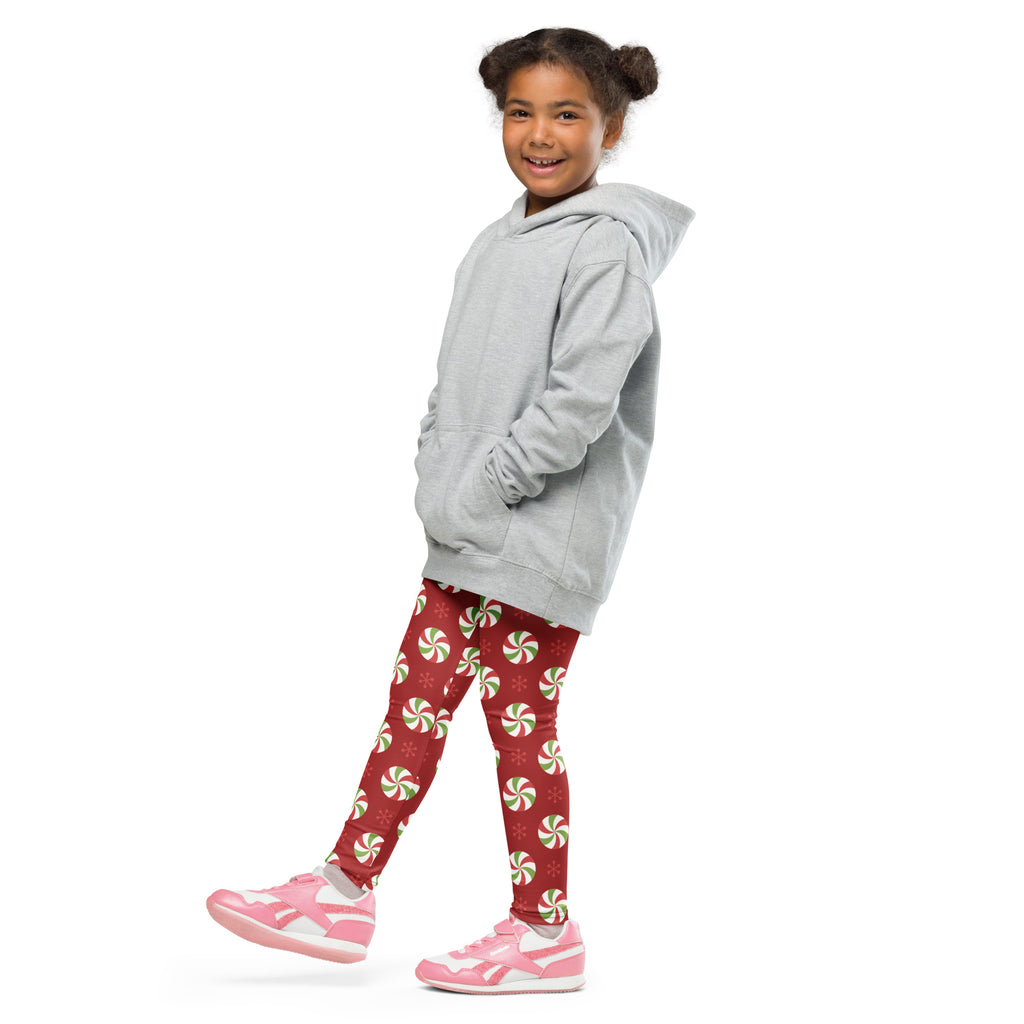 Gray hooded sweatshirt with relaxed fit and front pockets paired with kids christmas peppermint buttery soft leggings