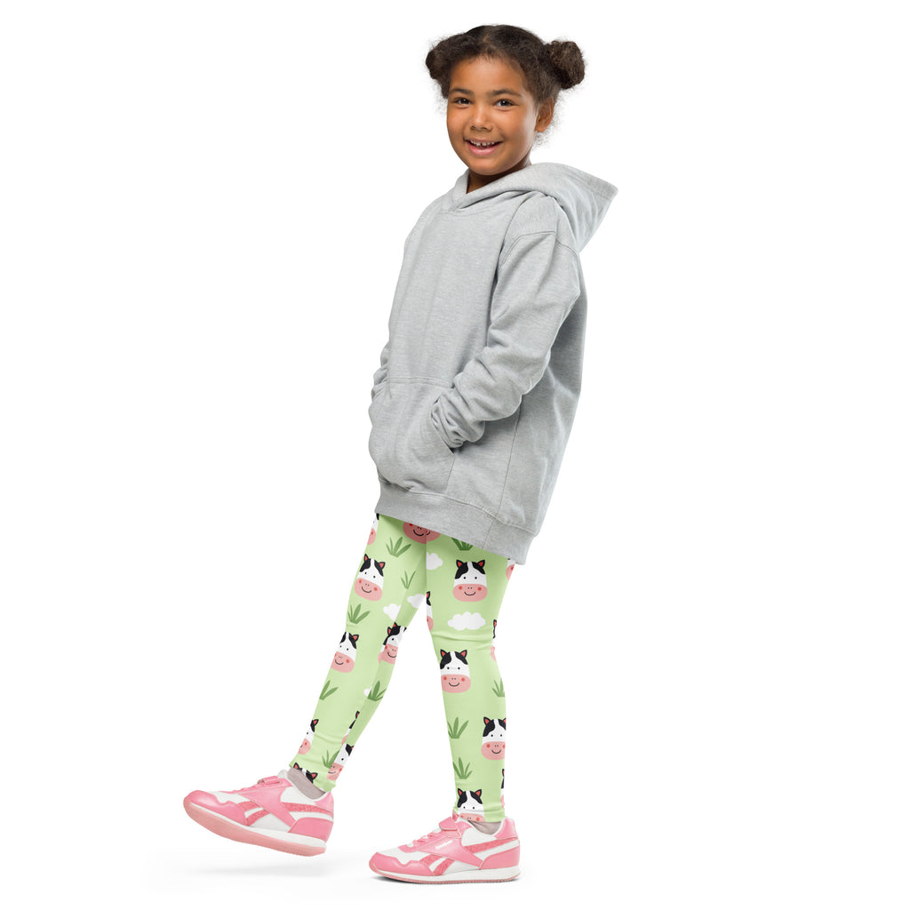 Gray hooded sweatshirt with front pockets and relaxed fit shown alongside kids cow print buttery soft leggings