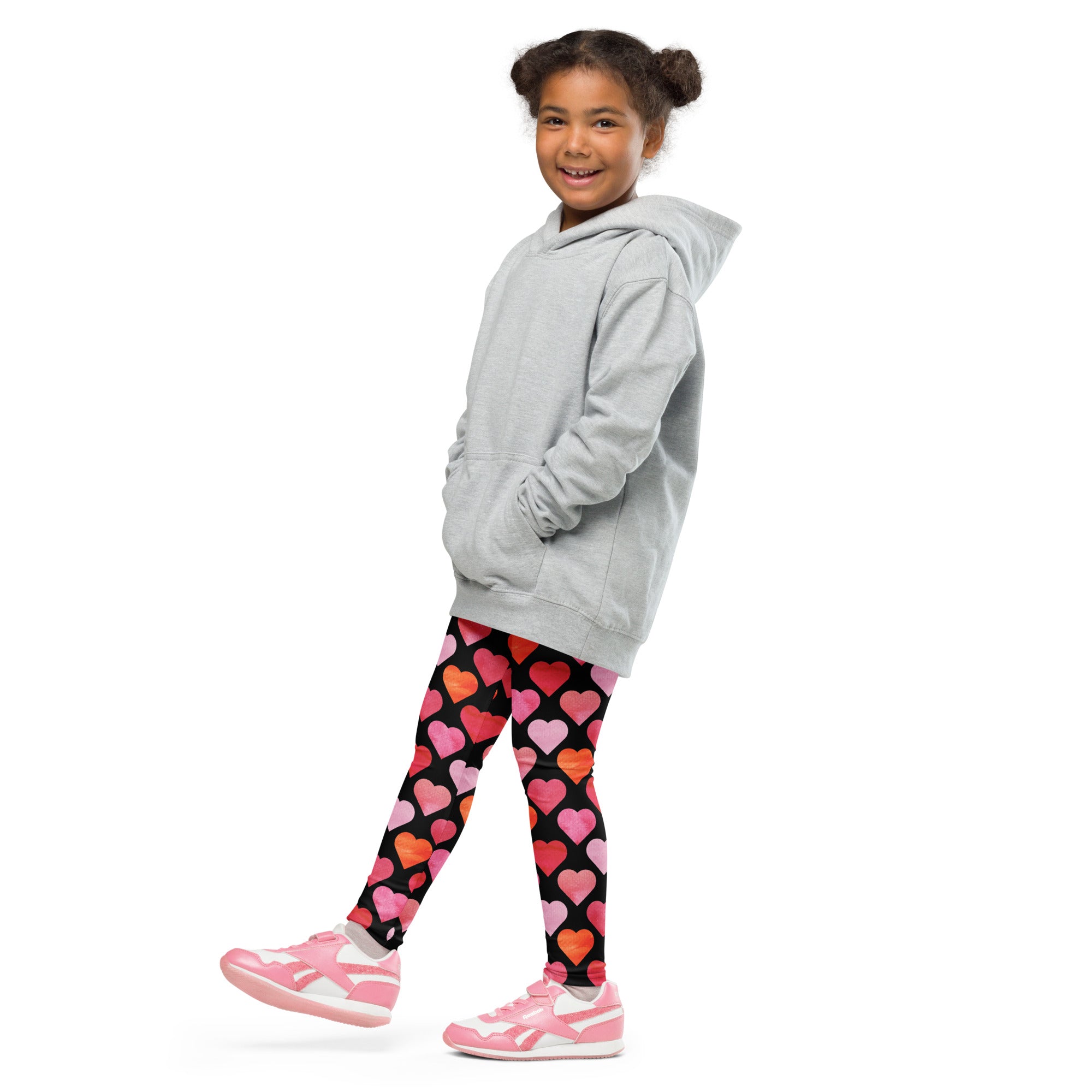 Gray hooded sweatshirt with front pockets and relaxed fit paired with girls black heart buttery soft leggings