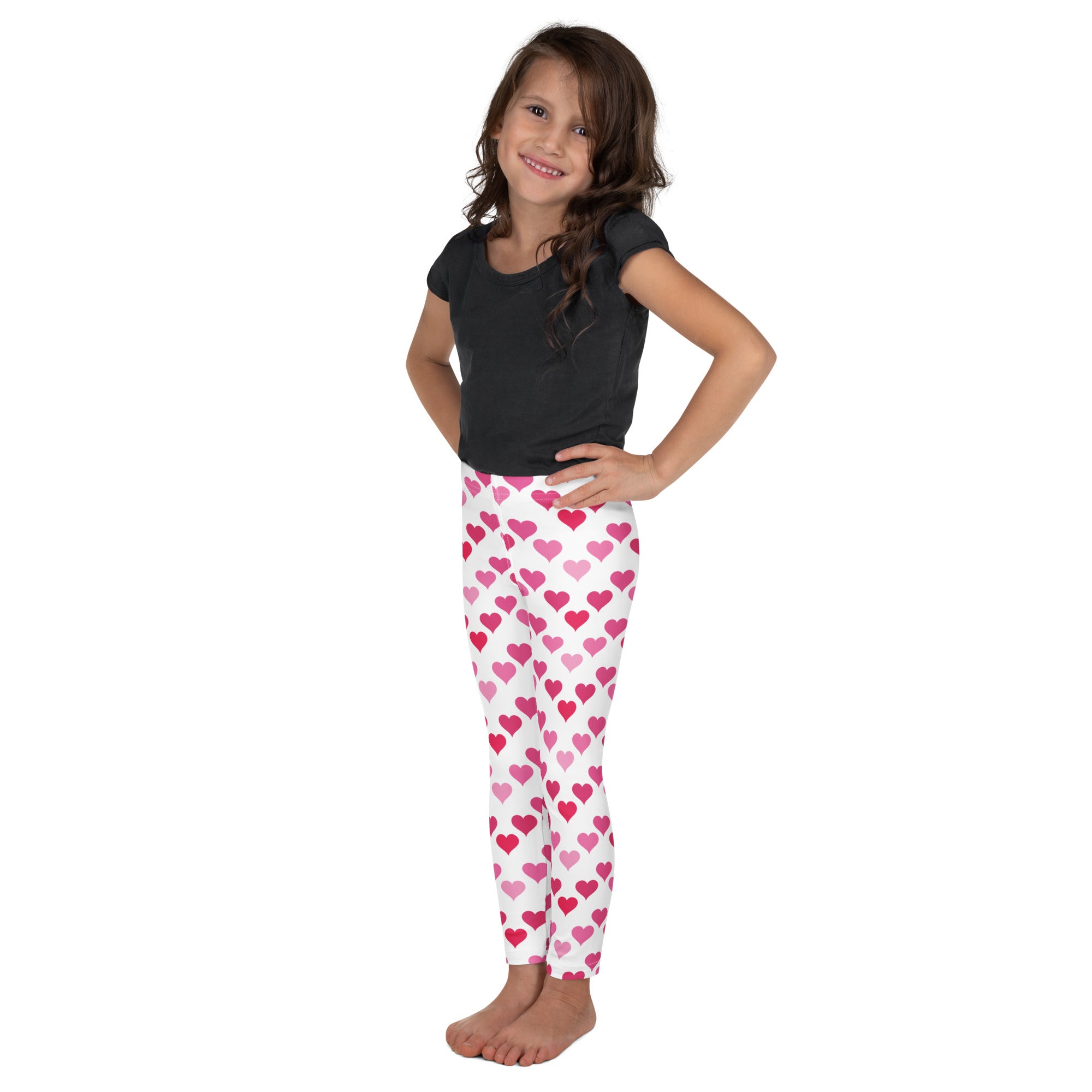 Girls Valentine’s Day white buttery soft leggings with playful pink and magenta heart pattern