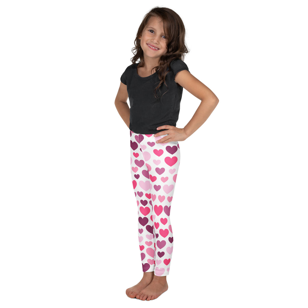 Girls purple and pink hearts buttery soft leggings featuring white fabric with playful pink and purple heart patterns