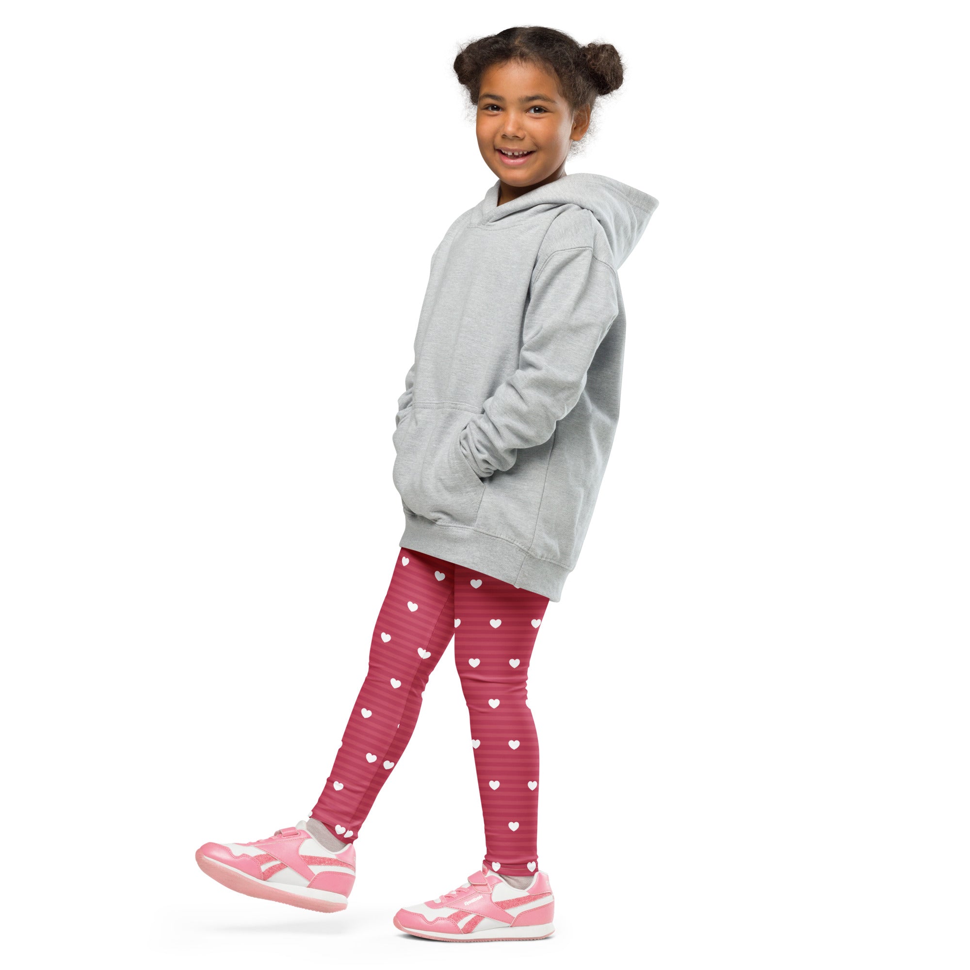 Gray hooded sweatshirt with front pockets and relaxed fit paired with girls pink stripe heart buttery soft leggings