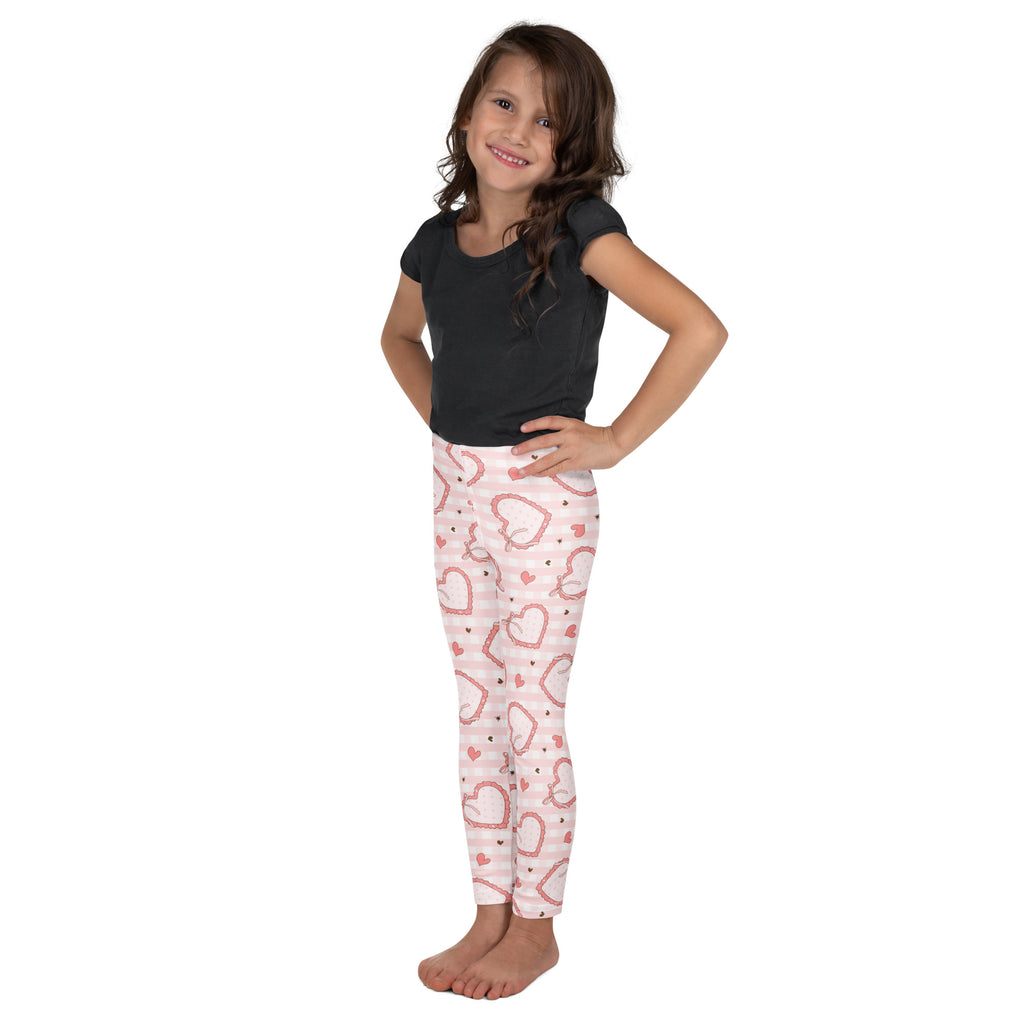 Girls pink heart patterned buttery soft leggings with subtle horizontal stripes and plaid bow detail