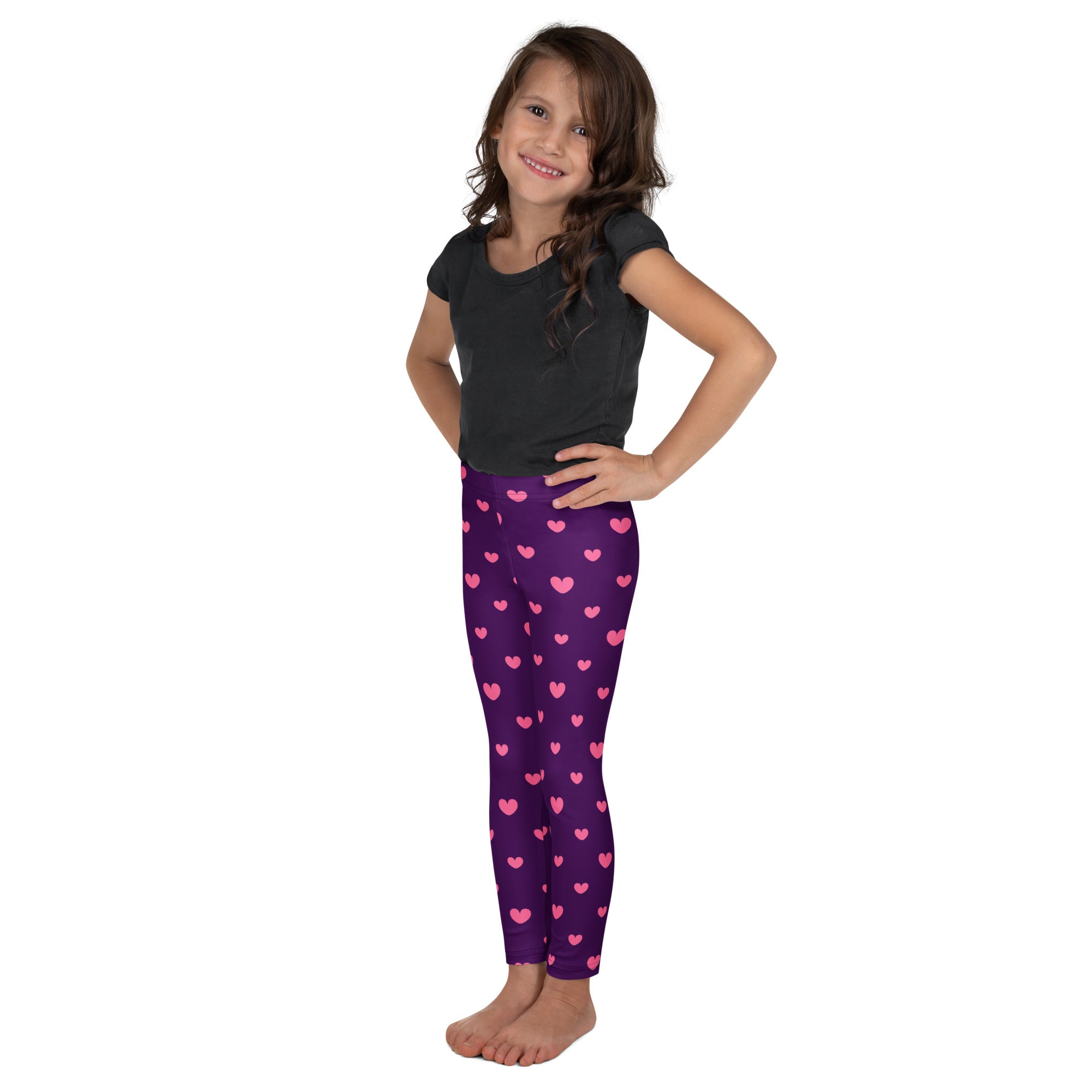 Girls purple heart leggings featuring pink heart patterns made from buttery soft fabric for comfortable wear
