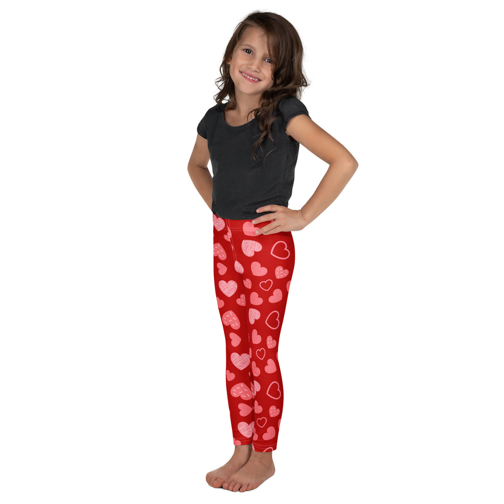 Girls red heart pattern leggings featuring pink and white hearts in buttery soft red fabric