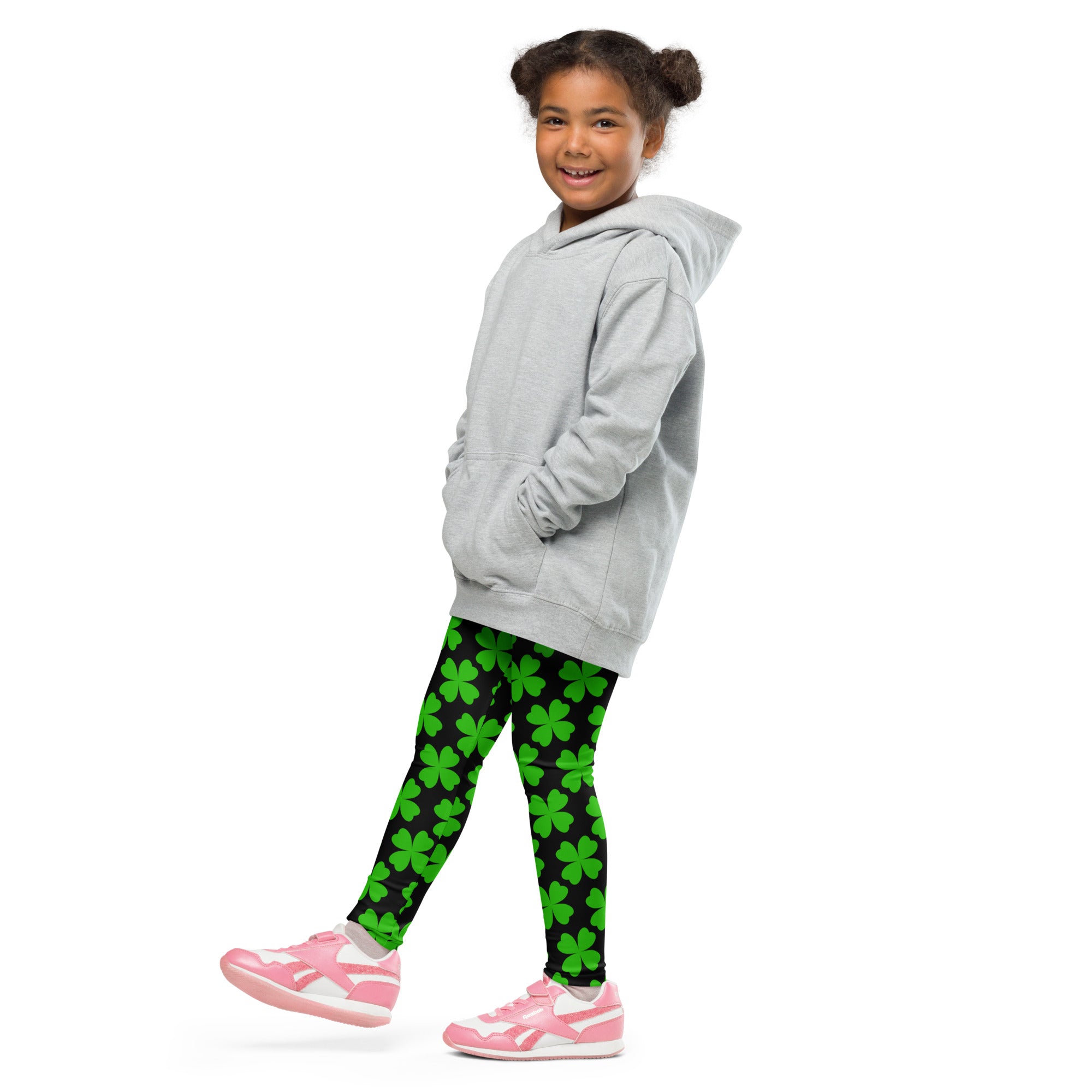 Gray hooded sweatshirt with front pockets and relaxed fit paired with girls black and green shamrock buttery soft leggings