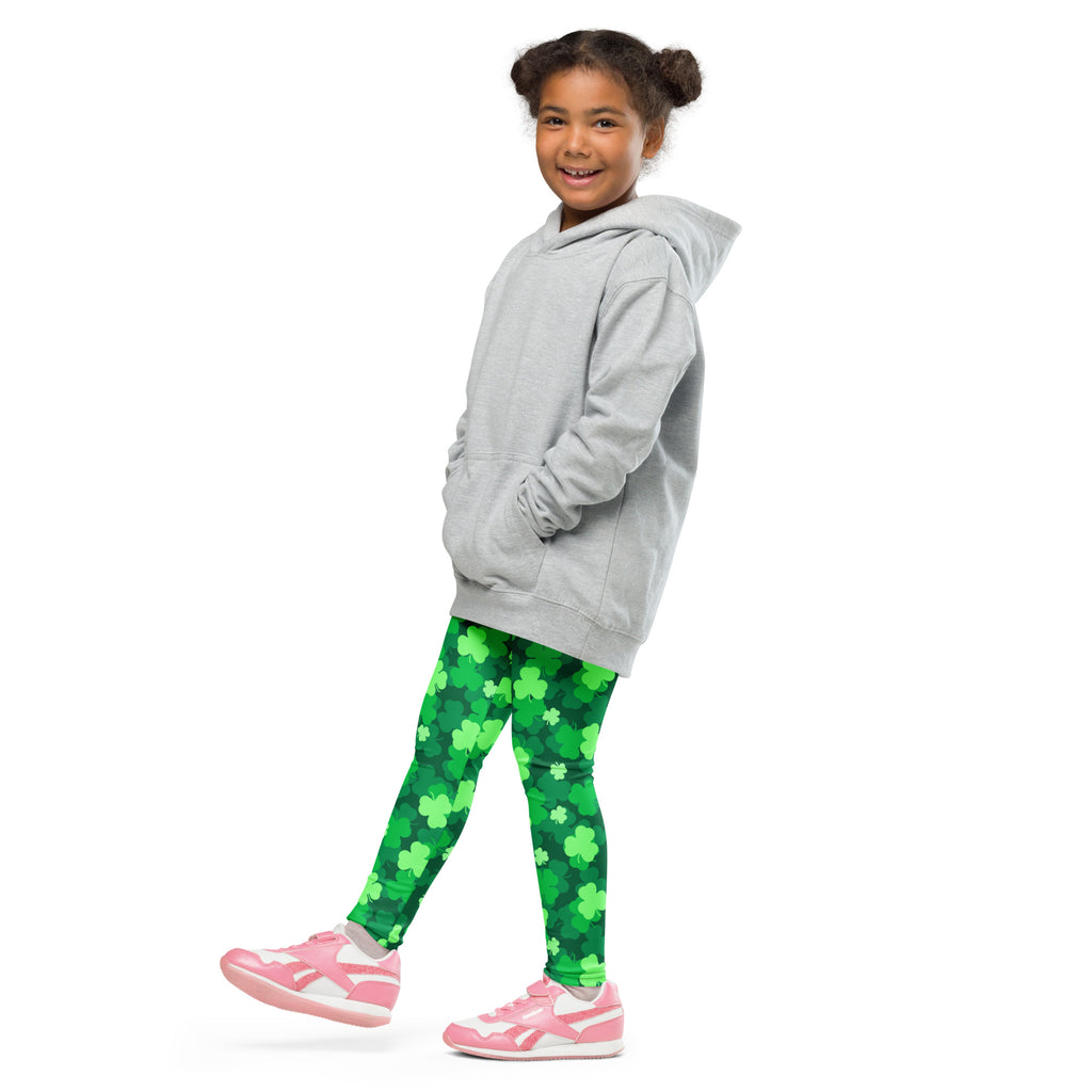 A child wearing girls emerald green shamrock buttery soft leggings and a gray hooded sweatshirt