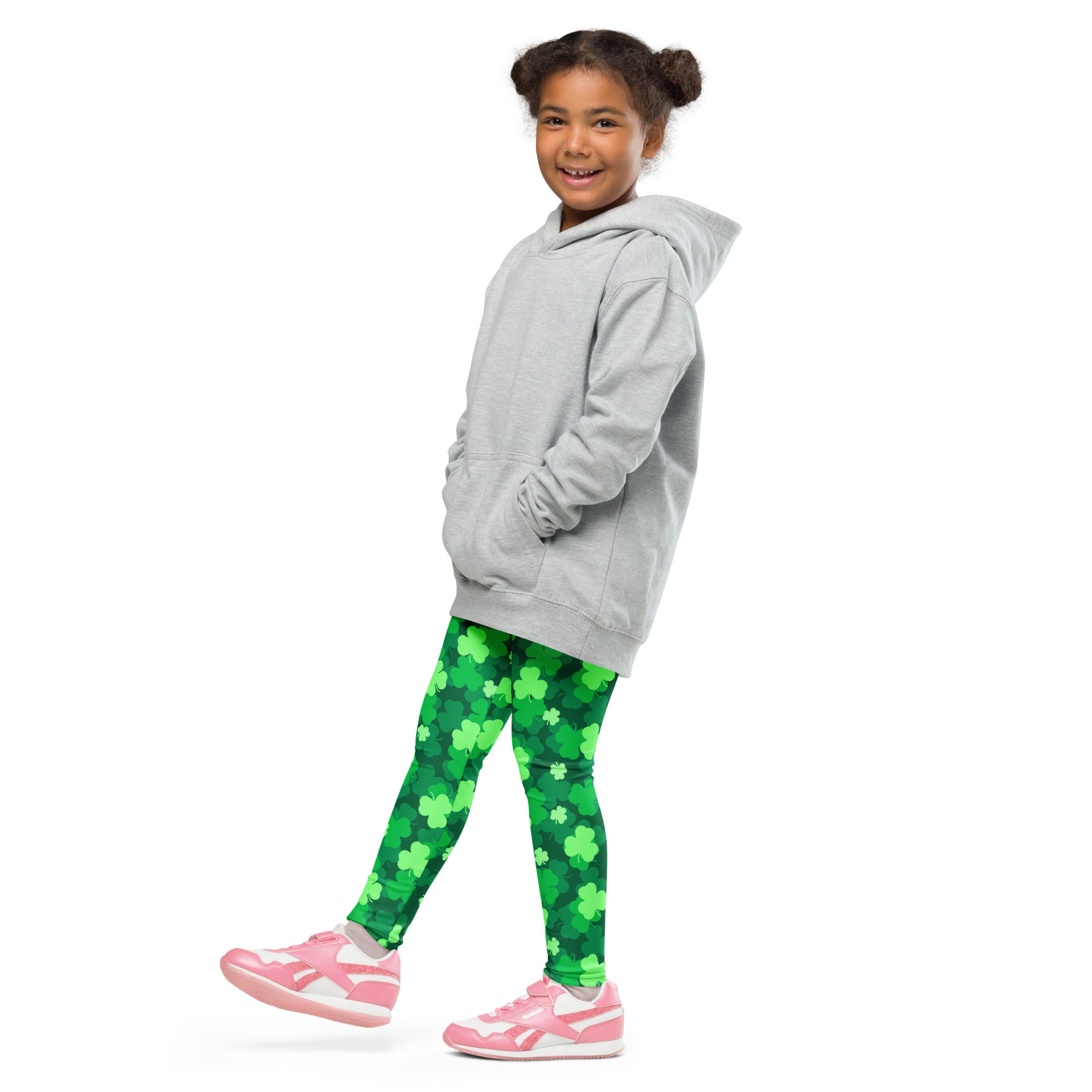 A child wearing girls emerald green shamrock buttery soft leggings and a gray hooded sweatshirt