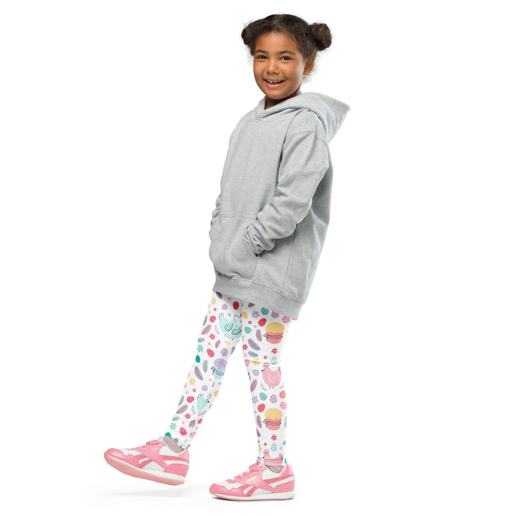 A child wearing girls Easter bunny and chick buttery soft white leggings with pastel cupcake strawberry and flower patterns