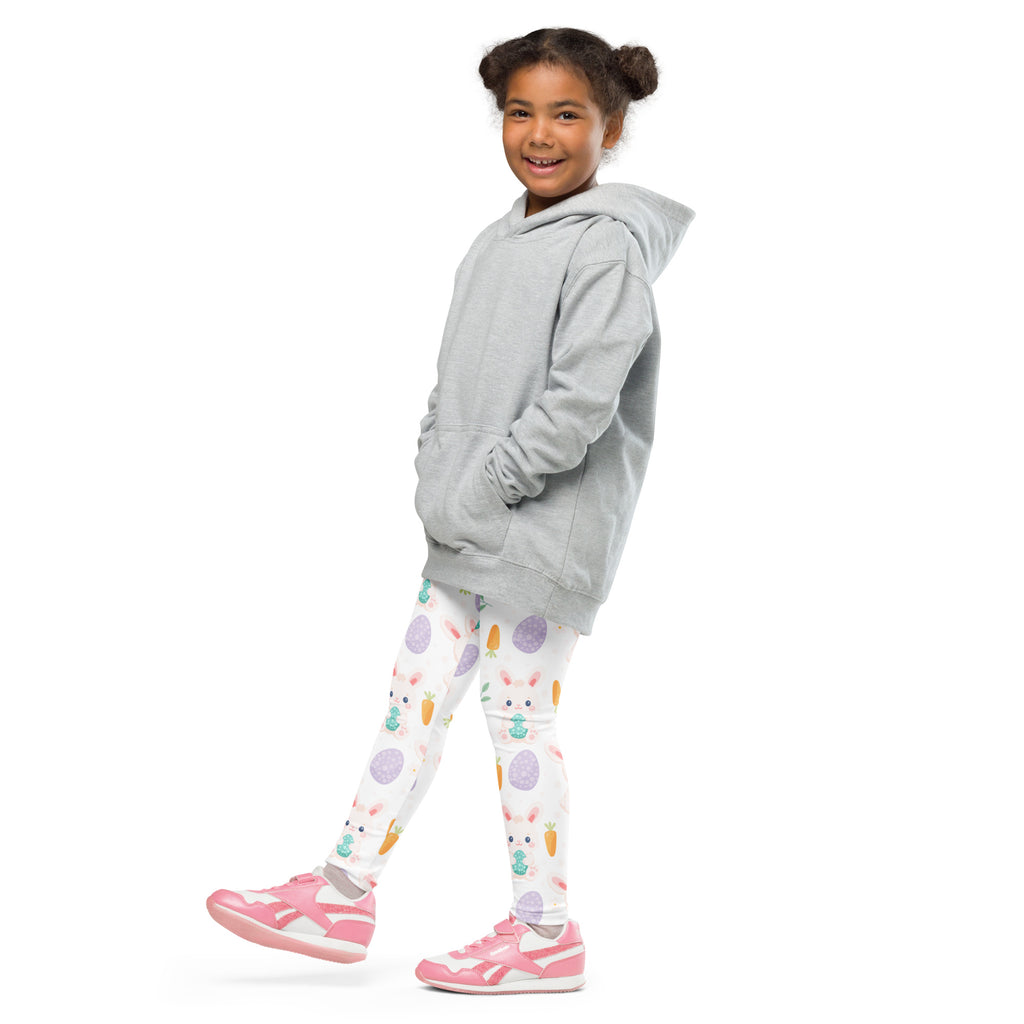 A child wearing girls cute Easter bunny buttery soft white leggings with colorful bunny carrot and egg patterns