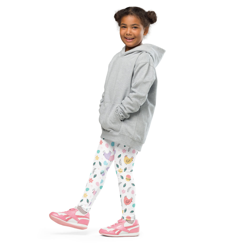 A child wearing girls pastel Easter chick buttery soft white leggings with colorful cartoon chickens flowers and eggs