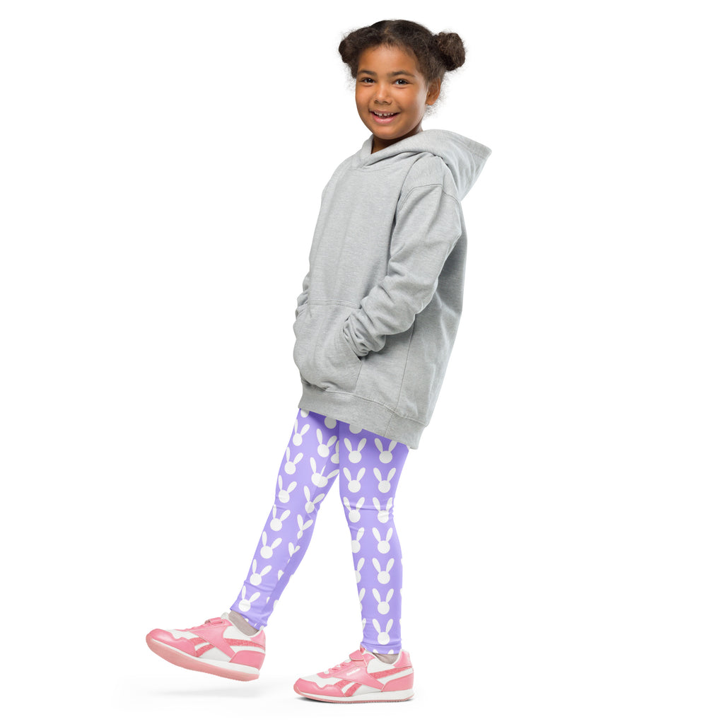 A young girl wearing girls purple Easter bunny buttery soft leggings in lavender with white bunny prints and pink shoes