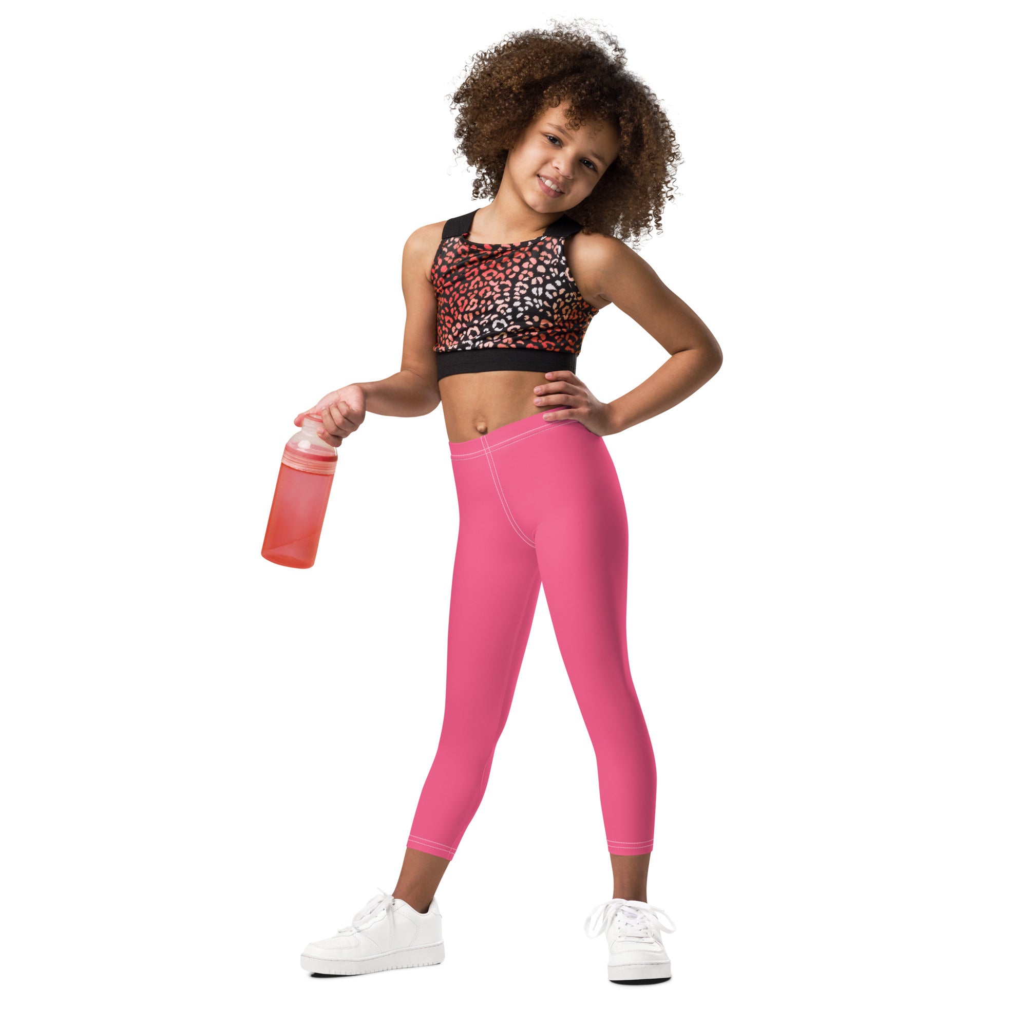 Girls buttery soft pink leggings made of smooth stretchy fabric with a high waisted design