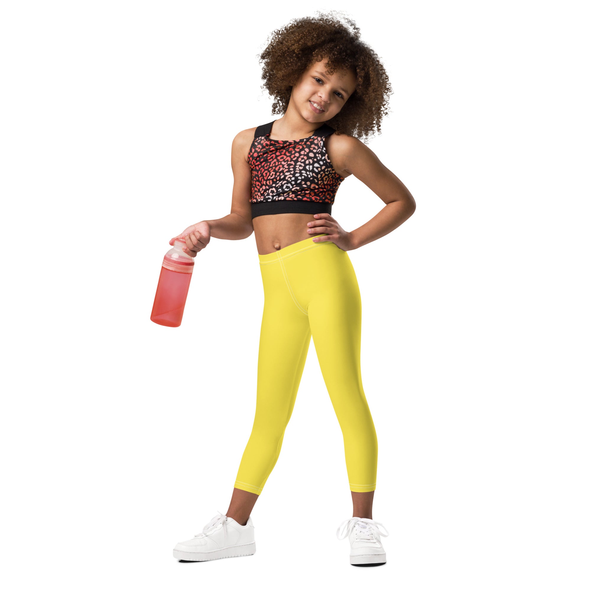 Kids buttery soft yellow leggings made of bright yellow smooth stretchy fabric for comfortable wear