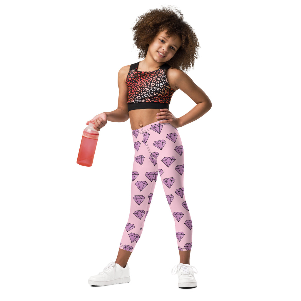 Girls buttery soft pink leggings with a repeating pattern of purple diamond shapes perfect for everyday wear