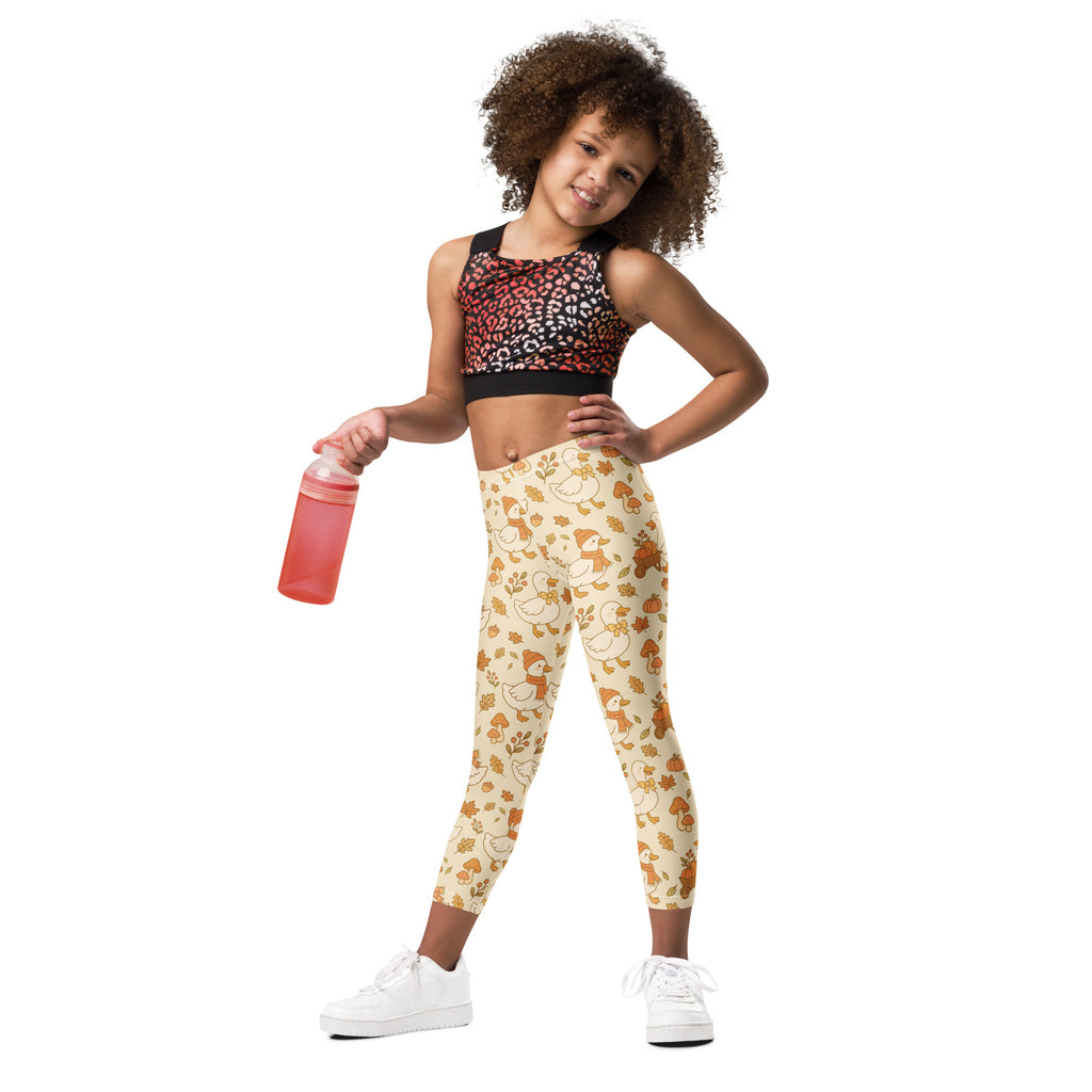 Cream-colored kids fall goose buttery soft leggings with playful orange ducks mushrooms and leaves pattern