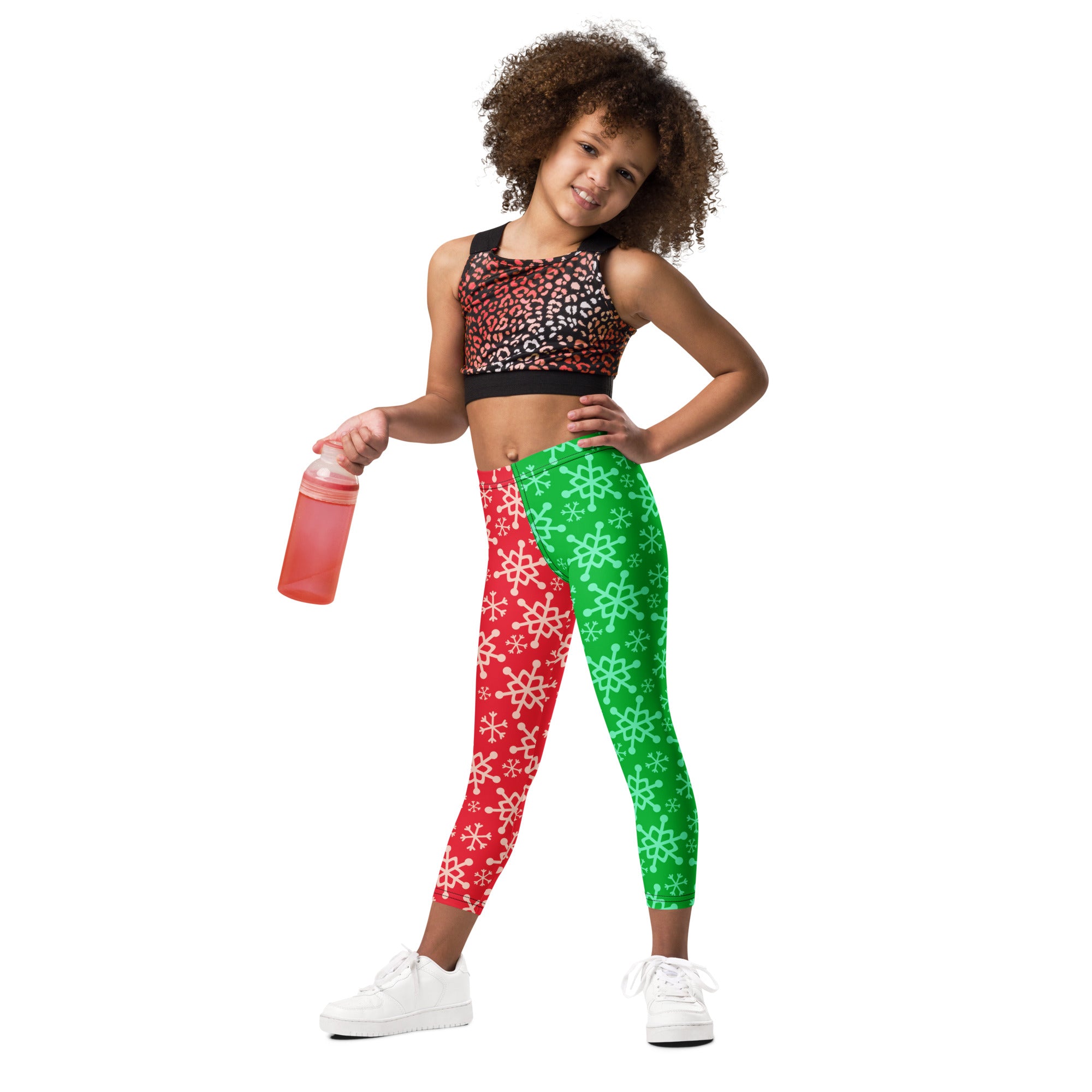 Kids red and green snowflake buttery soft leggings with split design featuring white and light green snowflakes