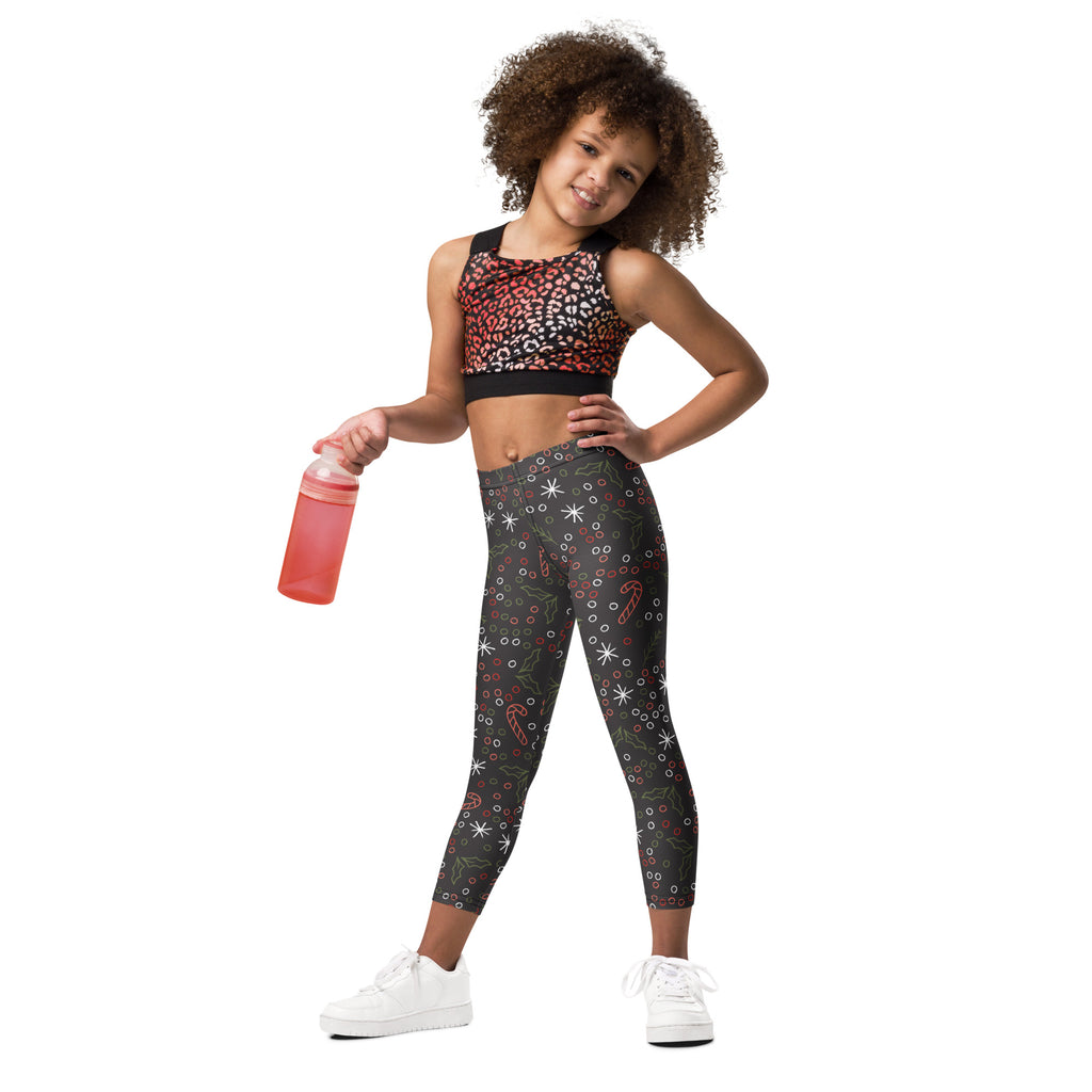 Kids christmas candy canes and holly leaves buttery soft black leggings with white stars red candy canes and green holly leaves pattern
