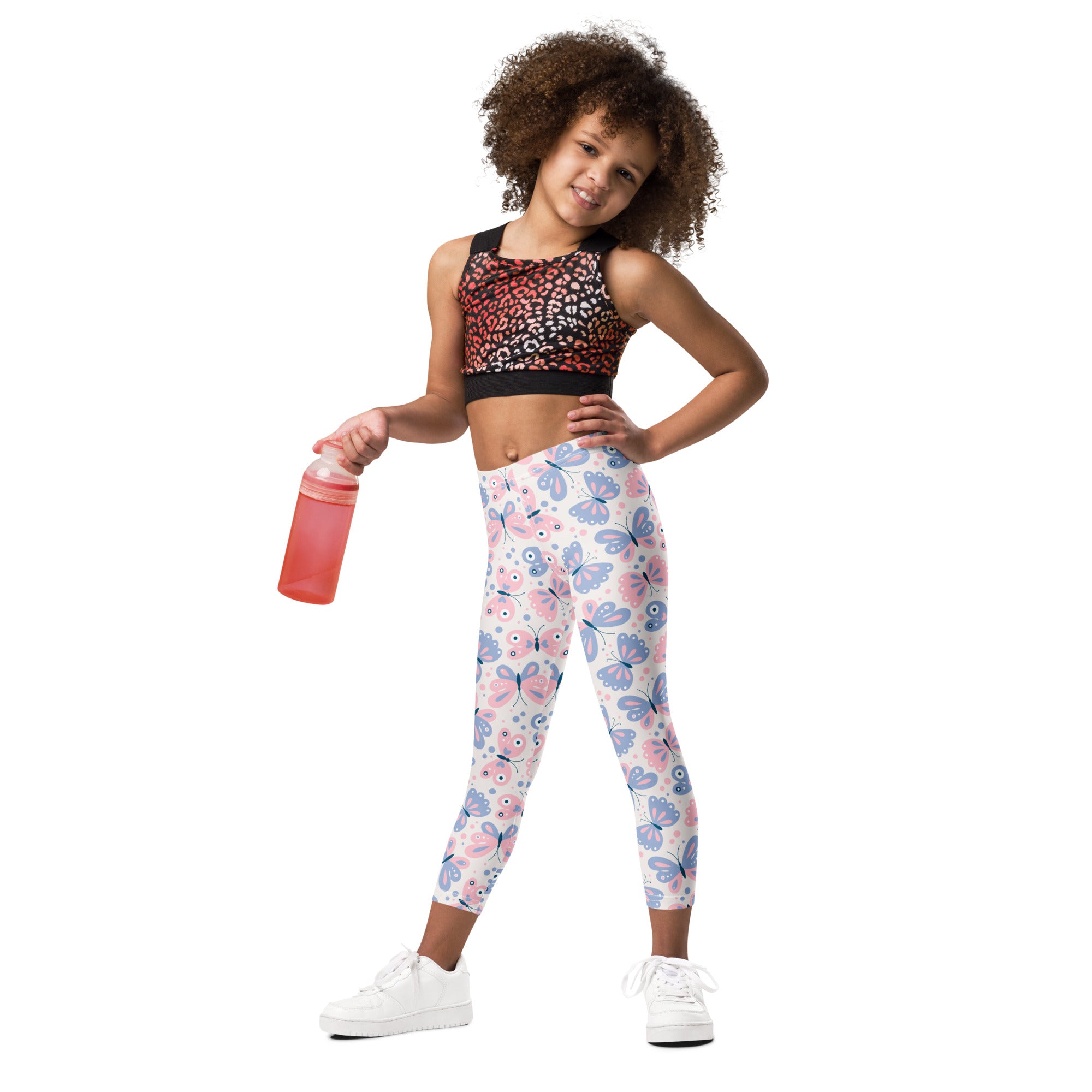Girls pink and lavender butterfly buttery soft leggings with white base featuring pink and purple butterfly patterns