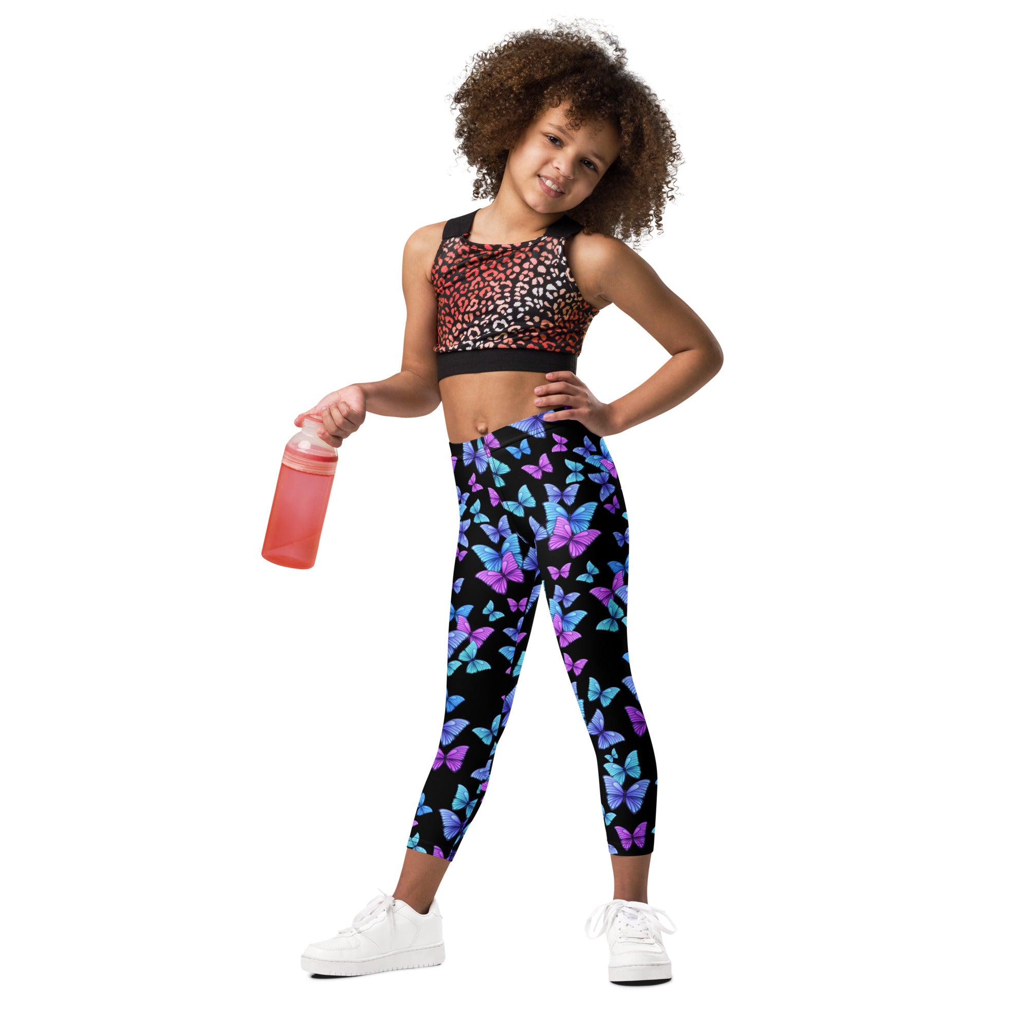 Girls vibrant butterfly buttery soft leggings in black with multicolored purple blue and pink butterfly pattern