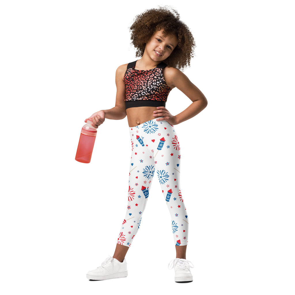 White buttery soft kids leggings with red white and blue fireworks stars and rocket ships patriotic pattern
