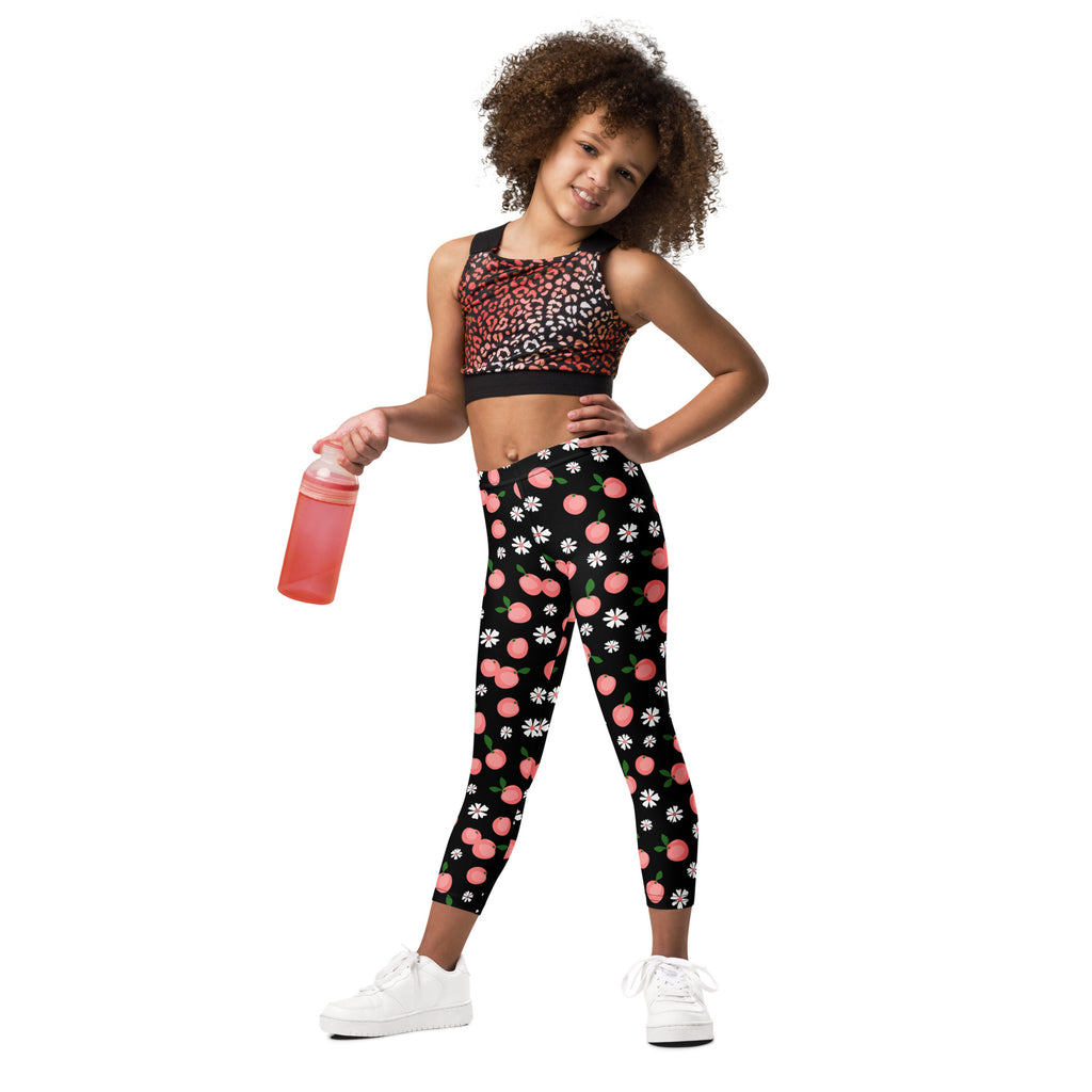 Girls peach blossom print buttery soft black leggings with playful pink peaches and white daisies pattern