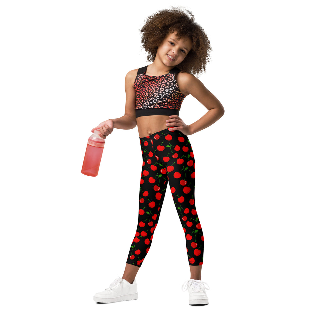 Girls black cherry buttery soft leggings with a snug fit design featuring vibrant red cherry pattern and green stems