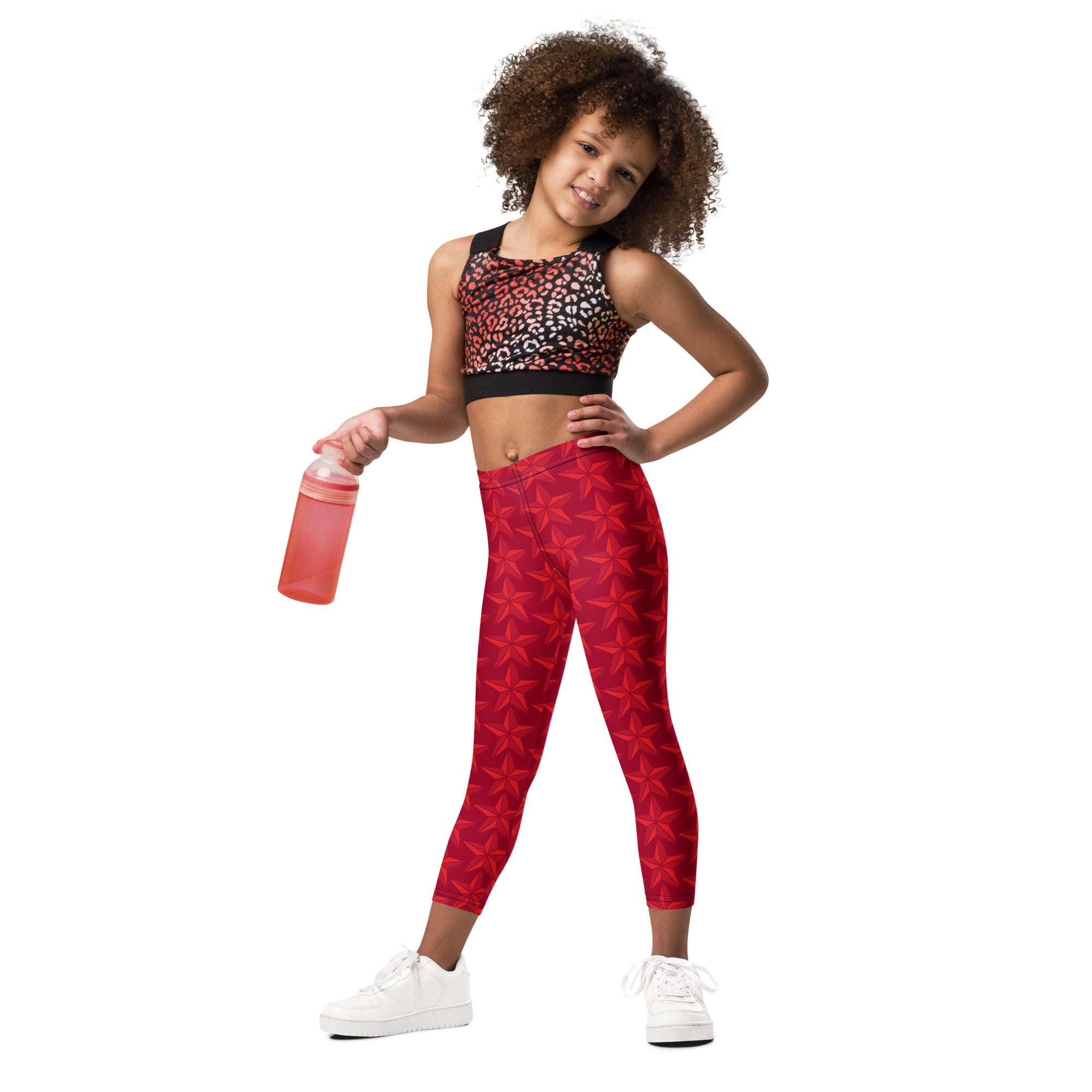 Girls christmas red star buttery soft leggings featuring red fabric with star patterns for festive wear