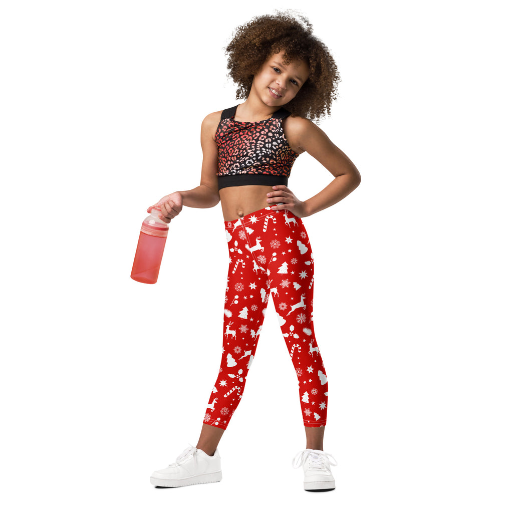 Kids red christmas pattern buttery soft leggings featuring white reindeer snowflakes and candy canes design